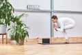 yoga kakasana postures in blonde Caucasian woman with sports clothes in a indoor studio