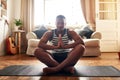 Yoga made me a better person. a young man practising yoga at home during the day.