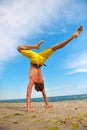 Yoga man standing on hands Royalty Free Stock Photo
