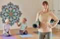 Yoga, mat and portrait of a senior woman in zen studio for a mind and body wellness workout. Happy, smile and calm Royalty Free Stock Photo
