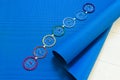 Blue yoga mat and seven chakra decoration. Yoga concept.