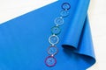 Blue yoga mat and seven chakra decoration. Yoga concept.