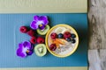 yoga mat with smoothie bowl and fruit for postworkout snack