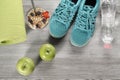 Yoga mat with sport shoes and healthy food