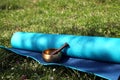 Yoga mat and Tibetan singing bowl meditation items Royalty Free Stock Photo