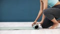 Yoga, mat and woman in fitness studio mockup for wellness marketing, advertising and brand with legs zoom. blue walll