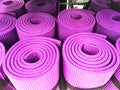 Yoga mats constricted, rolled-up on a shelf in the closet Royalty Free Stock Photo