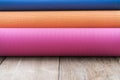 Yoga mats on the wooden table background Royalty Free Stock Photo