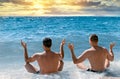 Yoga meditation on beach, enjoying the sunset