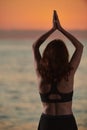 Yoga and meditation on calm beach at sunrise Royalty Free Stock Photo