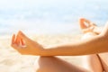 Yoga Meditation Exercise, Relaxing Woman Sit on Sea Beach, Hands in Focus Royalty Free Stock Photo