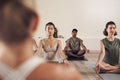 Yoga, meditation and group in a wellness and health class to relax with zen and peace. Female people, spiritual and