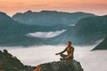 Yoga meditation in mountains man traveler relaxing alone