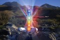 Yoga meditation outdoors. Glowing seven all chakra. Woman sits in a Upward Salute Lotus pose on mountain river view, Kundalini