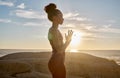Yoga, meditation or sunset with woman in peace by the ocean, sea or beach for wellness, zen or chakra balance. Spiritual Royalty Free Stock Photo