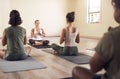 Yoga, meditation teacher and group in wellness and health class to relax with zen and peace. Female people, spiritual