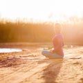 Yoga meditation, woman on sunset Royalty Free Stock Photo