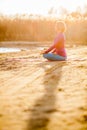 Yoga meditation, woman on sunset Royalty Free Stock Photo