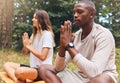 Yoga, man and woman in prayer hand pose together in nature, grass and outdoors. Zen, meditation and athletic friends