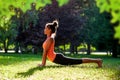 Yoga. mixed race woman practicing yoga or dancing or stretching in nature at park. Health lifestyle concept