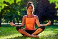 Yoga. mixed race woman practicing yoga or dancing or stretching in nature at park. Health lifestyle concept