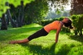 Yoga. mixed race woman practicing yoga or dancing or stretching in nature at park. Health lifestyle concept