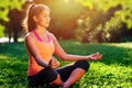 Yoga. mixed race woman practicing yoga or dancing or stretching in nature at park. Health lifestyle concept