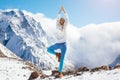 Yoga on mountain in winter Royalty Free Stock Photo