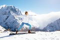 Yoga on mountain in winter Royalty Free Stock Photo