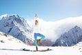 Yoga on mountain in winter Royalty Free Stock Photo