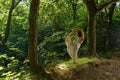 Woman doing yoga in the forest Royalty Free Stock Photo