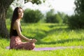 Yoga in nature. copycpase woman sitting in a pose Royalty Free Stock Photo