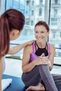 Glad mature woman prattling with yoga trainer Royalty Free Stock Photo