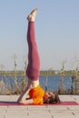 Yoga outdoor. Happy woman doing yoga exercises, meditate in the park. Yoga meditation in nature. Concept of healthy lifestyle and Royalty Free Stock Photo