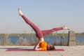 Yoga outdoor. Happy woman doing yoga exercises, meditate in the park. Yoga meditation in nature. Concept of healthy lifestyle and Royalty Free Stock Photo