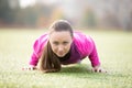 Yoga outdoors: four-limbed staff pose Royalty Free Stock Photo