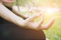 Yoga outdoors in summer park. young woman sits in lotus position Royalty Free Stock Photo