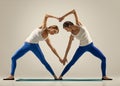 Yoga in pair. heart Royalty Free Stock Photo