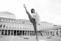 Yoga, pilates fitness, sport in paris, france. Woman split leg on square. Fashion beauty, style lifestyle. Girl in high