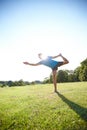 Yoga is the poetry of movement. Full length shot of a handsome mature man doing yoga outdoors. Royalty Free Stock Photo