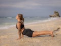 Yoga pose. Caucasian woman practicing Urdhva Mukha Svanasana, Upward-Facing Dog Pose. Strong body. Healthy lifestyle. Self-care Royalty Free Stock Photo