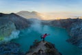 Yoga pose at the edge of Ijen Crater.