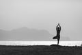 Yoga pose, woman meditating at the beach Royalty Free Stock Photo