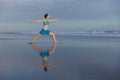 Yoga pose. Young woman practicing Virabhadrasana II, Warrior 2. Yoga retreat. Self care concept. Balance and concentration. Strong Royalty Free Stock Photo