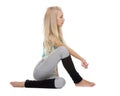 Yoga poses. Ardha Matsyendrasana variation Royalty Free Stock Photo