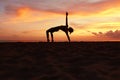 Yoga Poses. Woman Practicing Half Moon Asana On Ocean Beach. Female Silhouette Standing In Ardha Chandrasana At Beautiful Sunset. Royalty Free Stock Photo