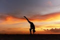 Yoga Poses. Woman Standing Split Asana Or One Foot Up Pose On Ocean Beach. Female Silhouette Practicing Urdhva Prasarita Eka. Royalty Free Stock Photo