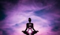 Yoga position silhouette in contrasting sun, Crown chakra