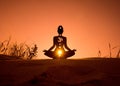 Yoga position silhouette in contrasting sun, Sacral chakra Royalty Free Stock Photo