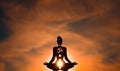 Yoga position silhouette in contrasting sun, Sacral chakra Royalty Free Stock Photo